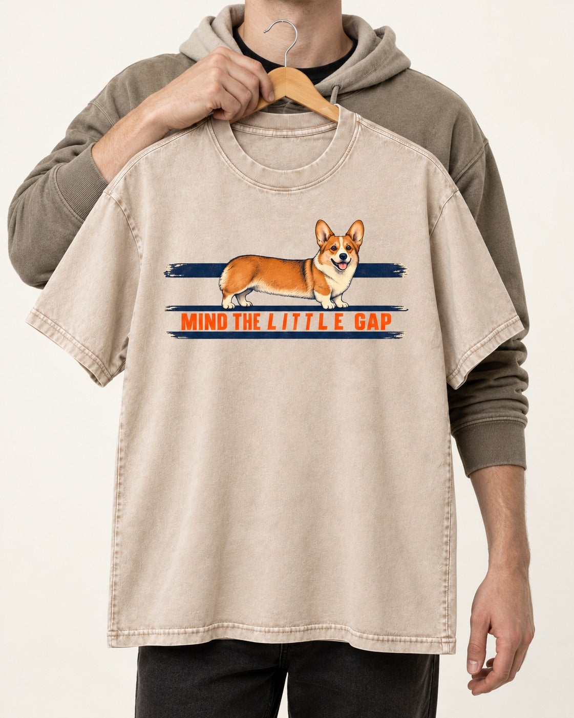 Mind the Little Corgi Gap Washed Tee in Apricot, held up on a hanger