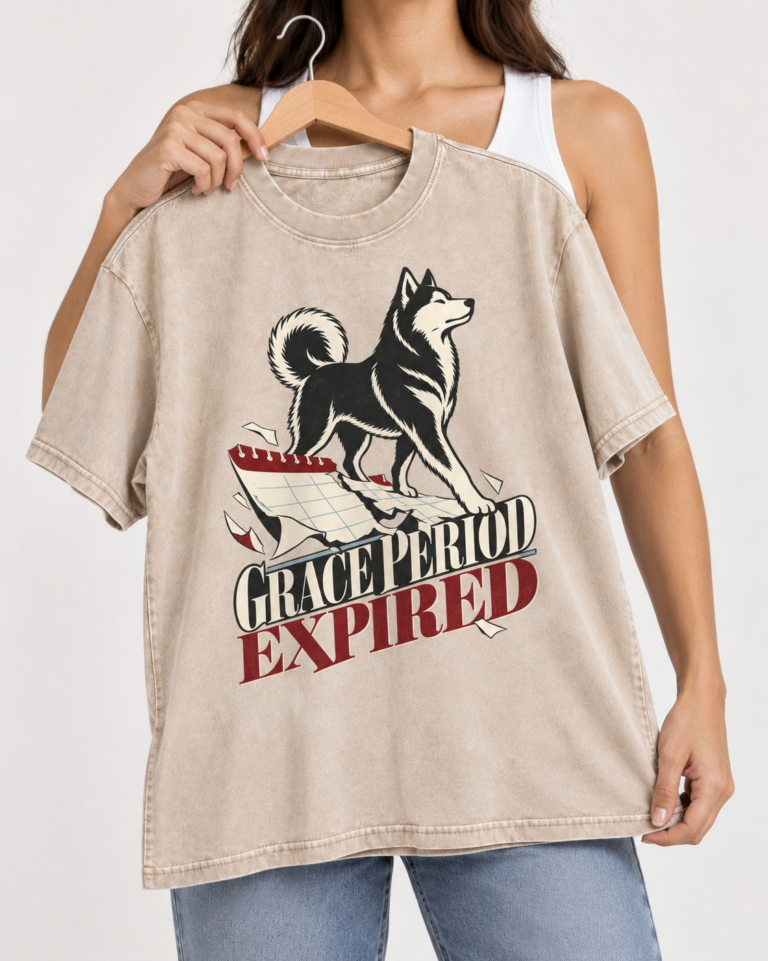 Husky Grace Period Expired Torn Calendar Graphic Washed Tee in Apricot, held up on a hanger