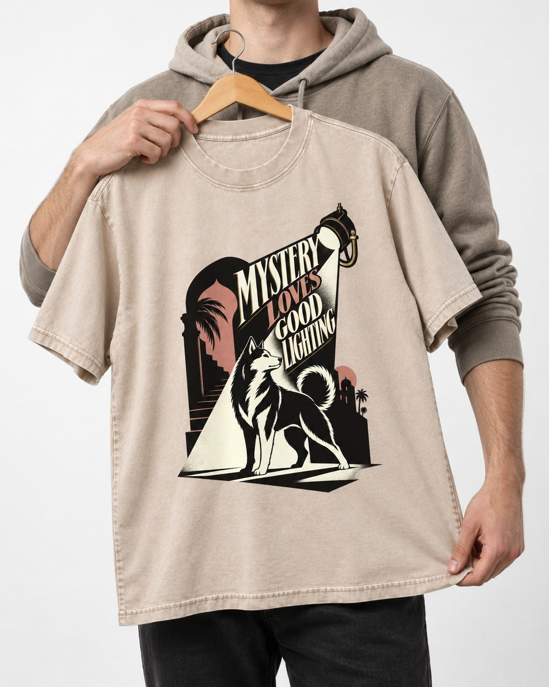 Husky Loves Good Lighting Washed Tee in Apricot, held up on a hanger