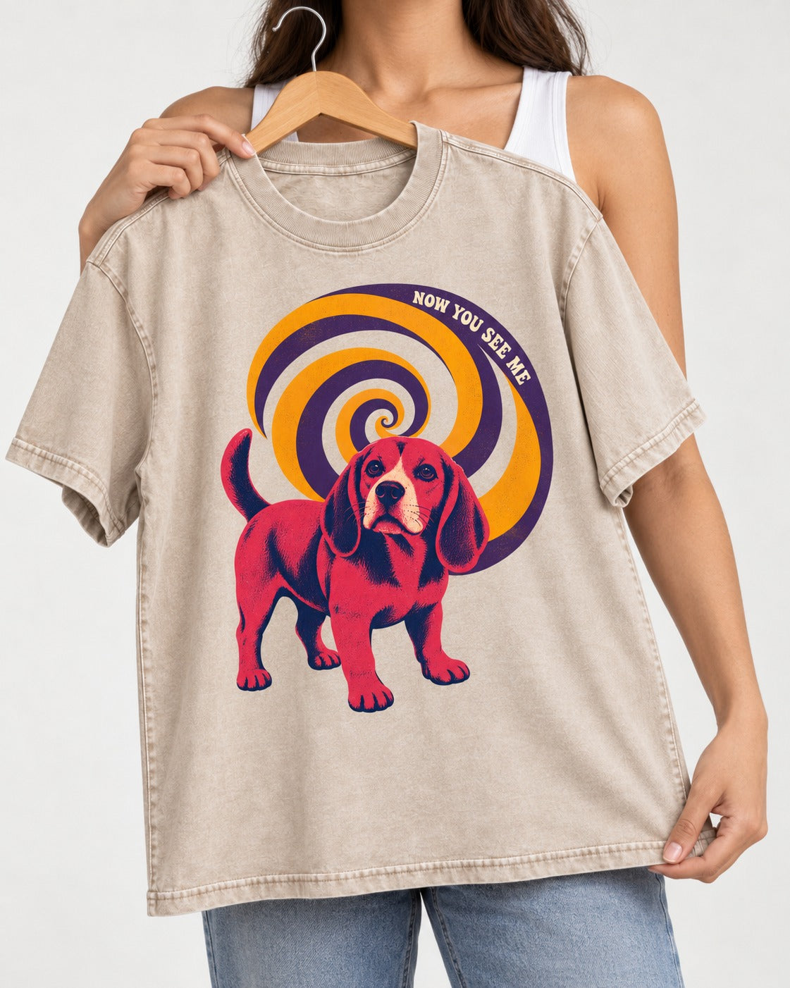 Now You See Me Beagle Spiral Washed Tee in Apricot, held up on a hanger