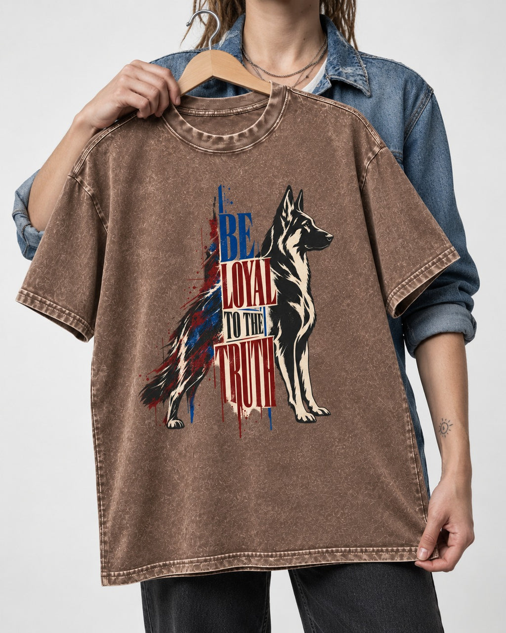 Loyal to the Truth German Shepherd Dog Washed Tee in Coffee, held up on a hanger