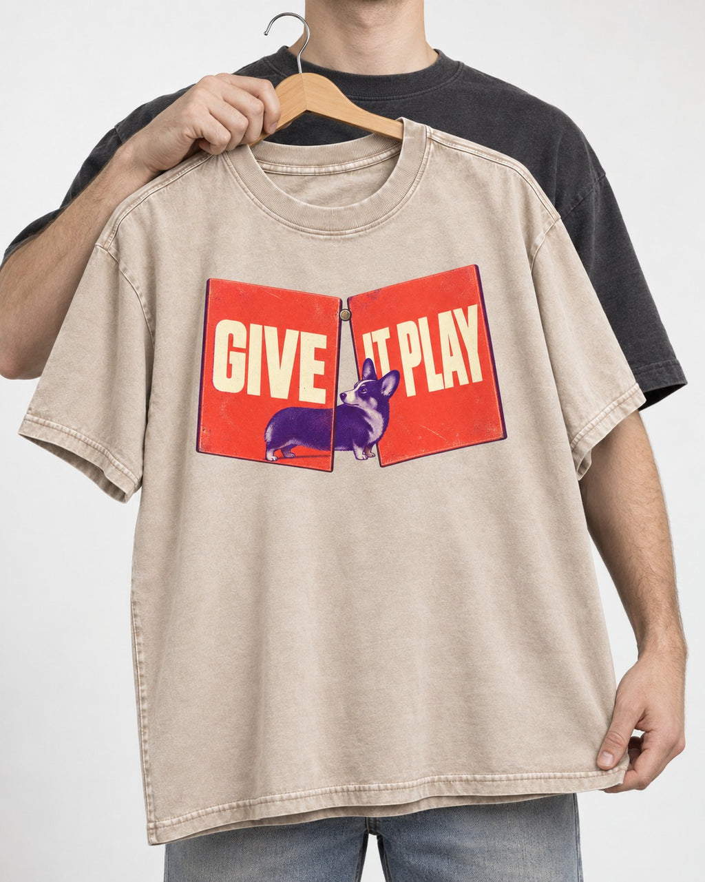 Corgi Give It Play Folding Panels Washed Tee in Apricot, held up on a hanger