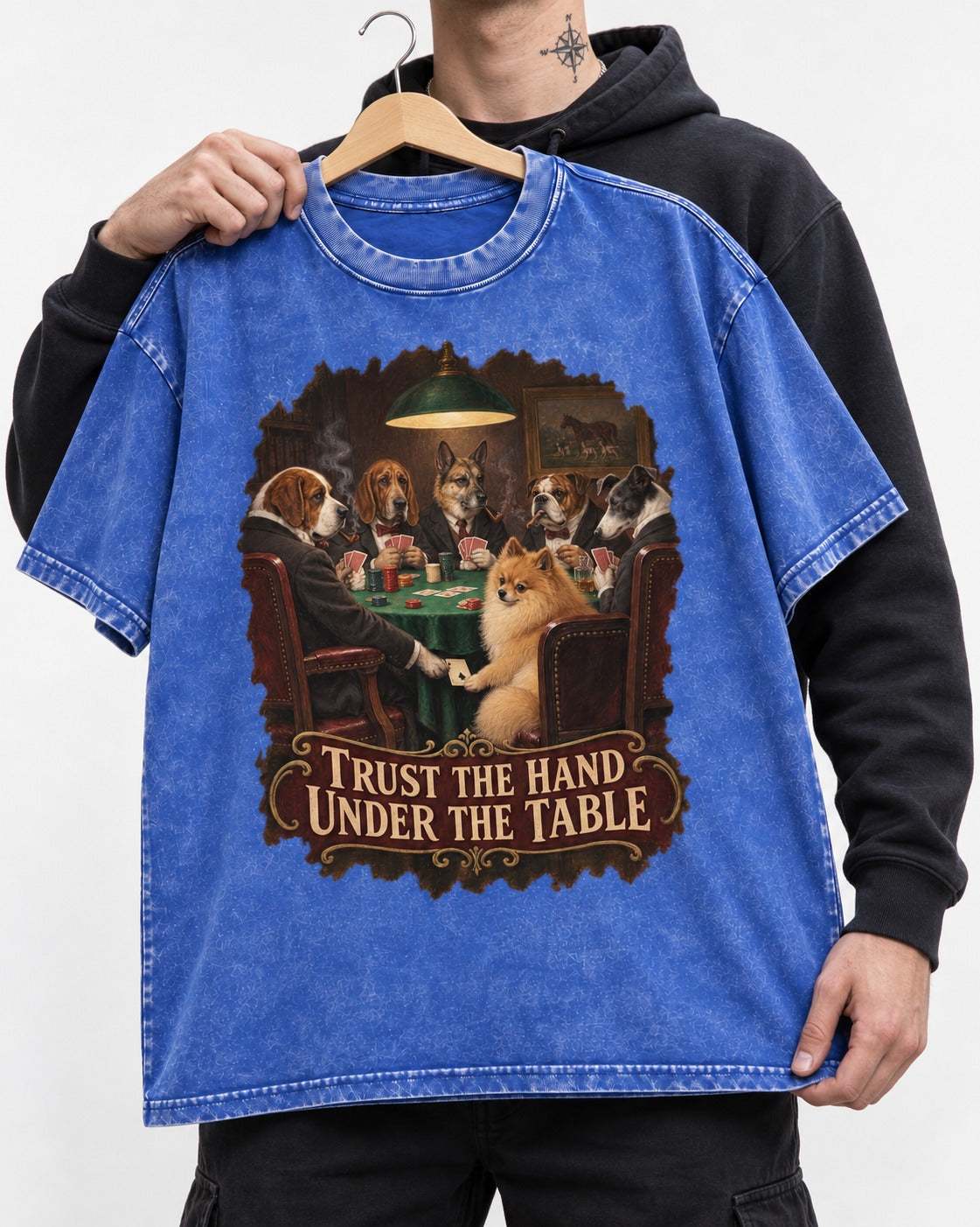 Pomeranian Trust the Hand Under the Table Poker Dogs Graphic Washed Tee in Royal Blue, held up on a hanger