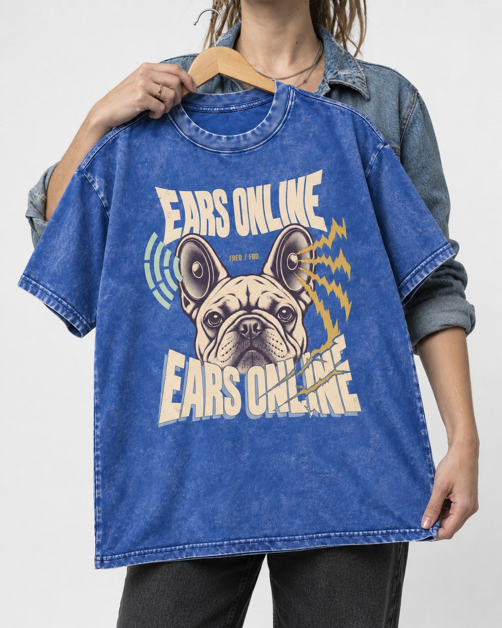 Frenchie Ears Online Audio Signal Graphic Washed Tee in Royal Blue, held up on a hanger