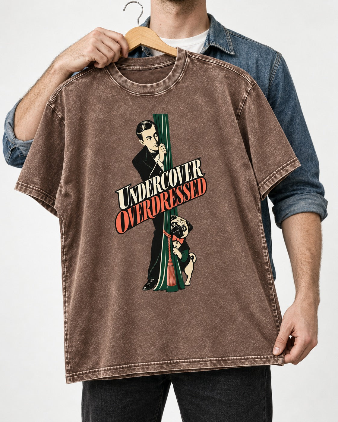 Undercover Overdressed Pug Washed Tee in Coffee, held up on a hanger