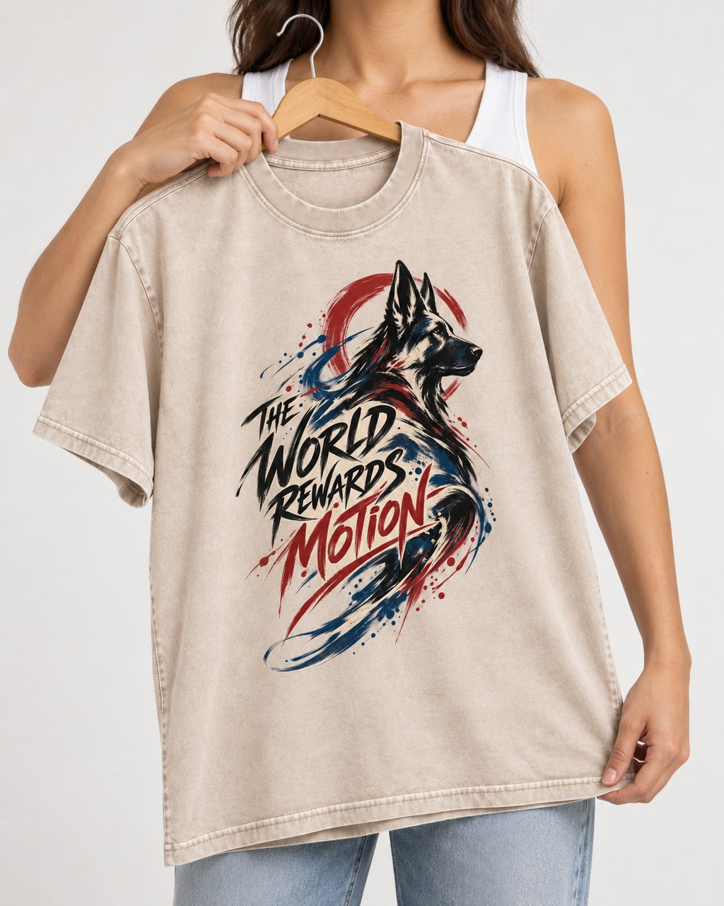 German Shepherd Dog The World Rewards Motion Washed Tee in Apricot, held up on a hanger