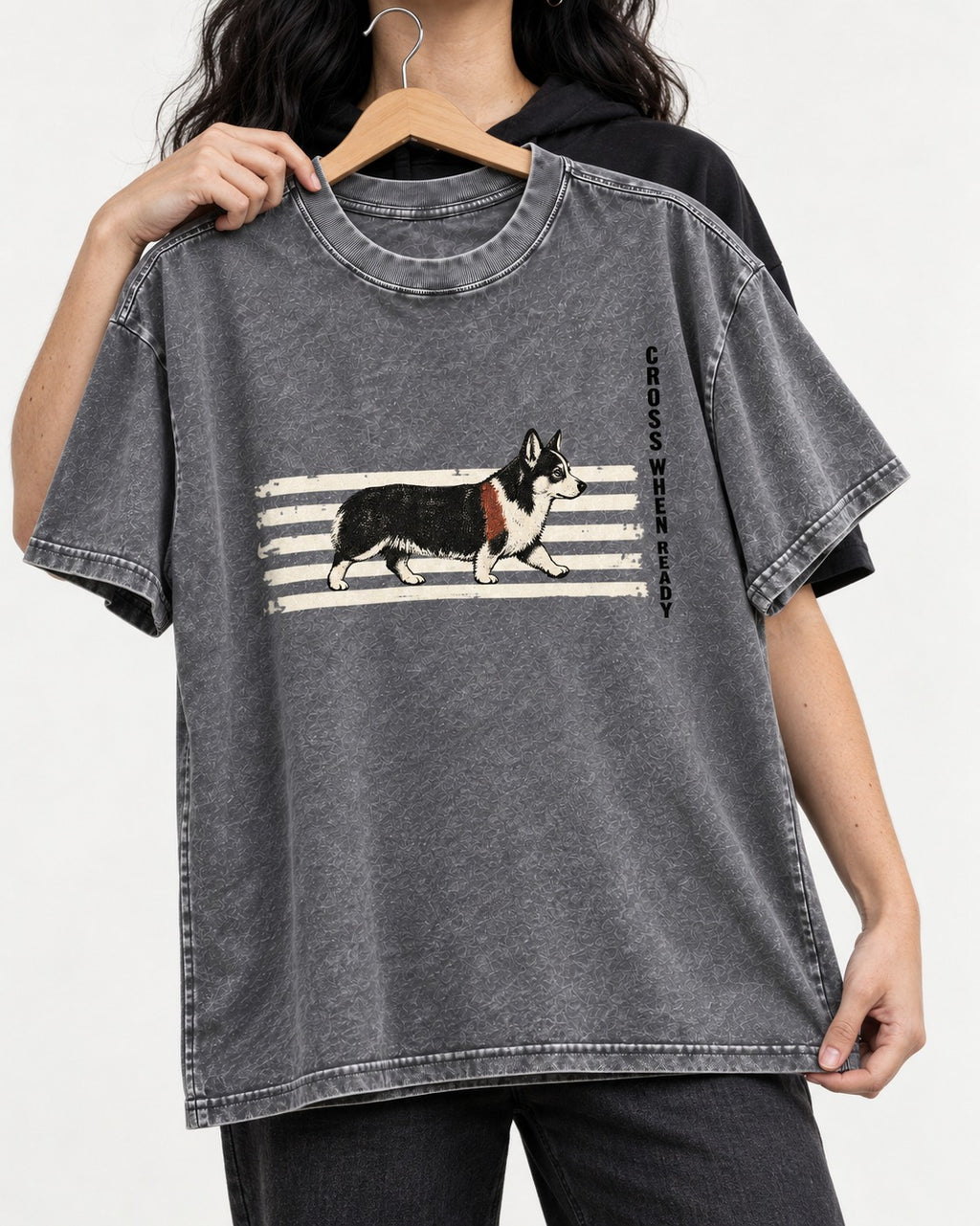 Corgi Cross When Ready Crossing Bars Graphic Washed Tee in Gray, held up on a hanger