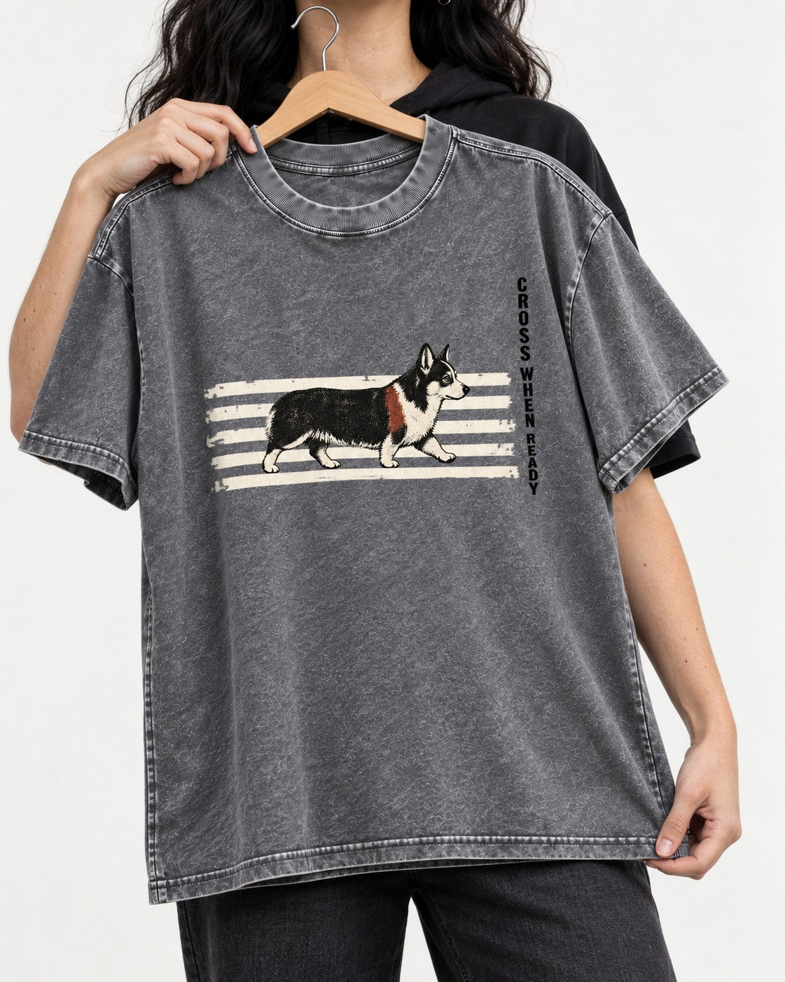 Corgi Cross When Ready Crossing Bars Graphic Washed Tee in Gray, held up on a hanger