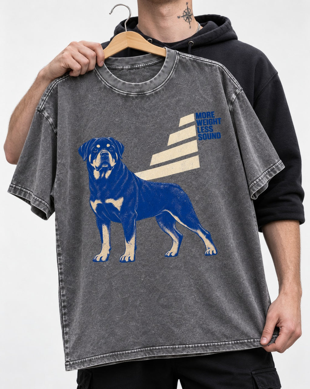 Rottweiler More Weight Less Sound Stair Step Graphic Washed Tee in Gray, held up on a hanger
