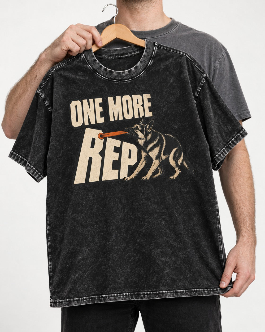 One More Rep Tug German Shepherd Dog Graphic Washed Tee in Black, held up on a hanger