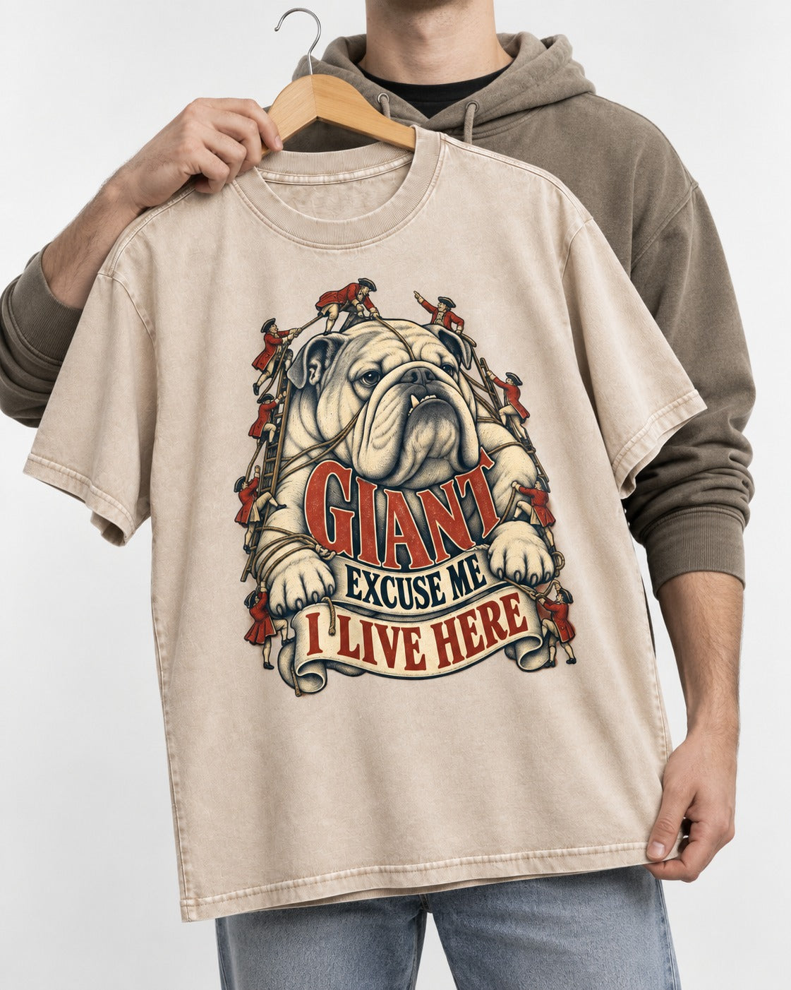 English Bulldog I Live Here Washed Tee in Apricot, held up on a hanger