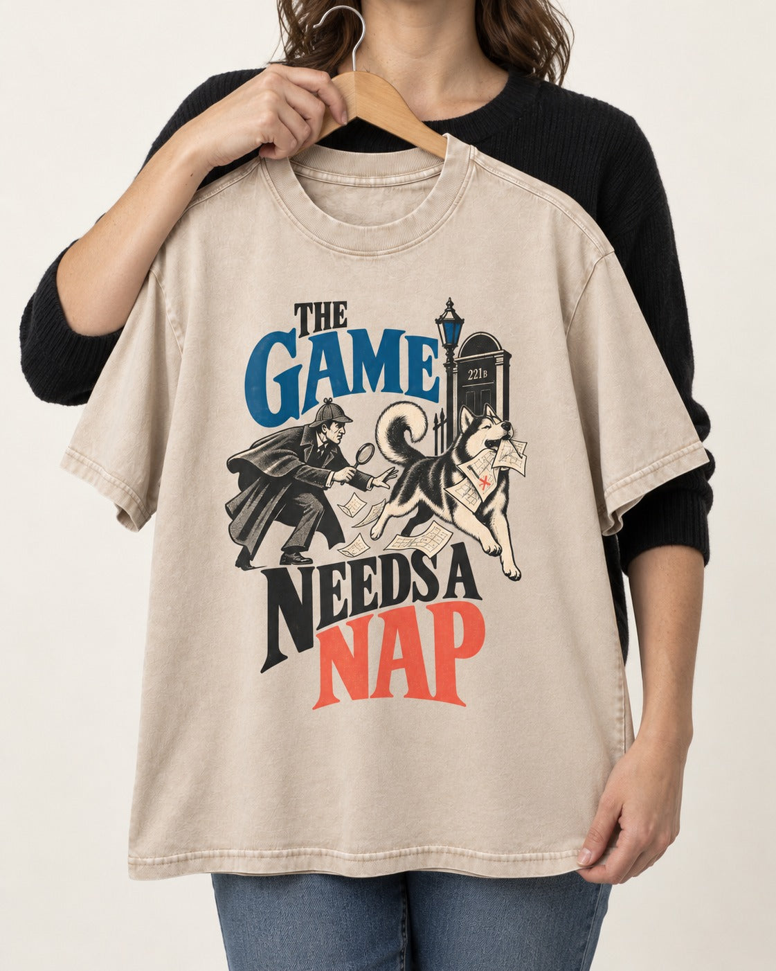 Husky Needs a Nap Washed Tee in Apricot, held up on a hanger