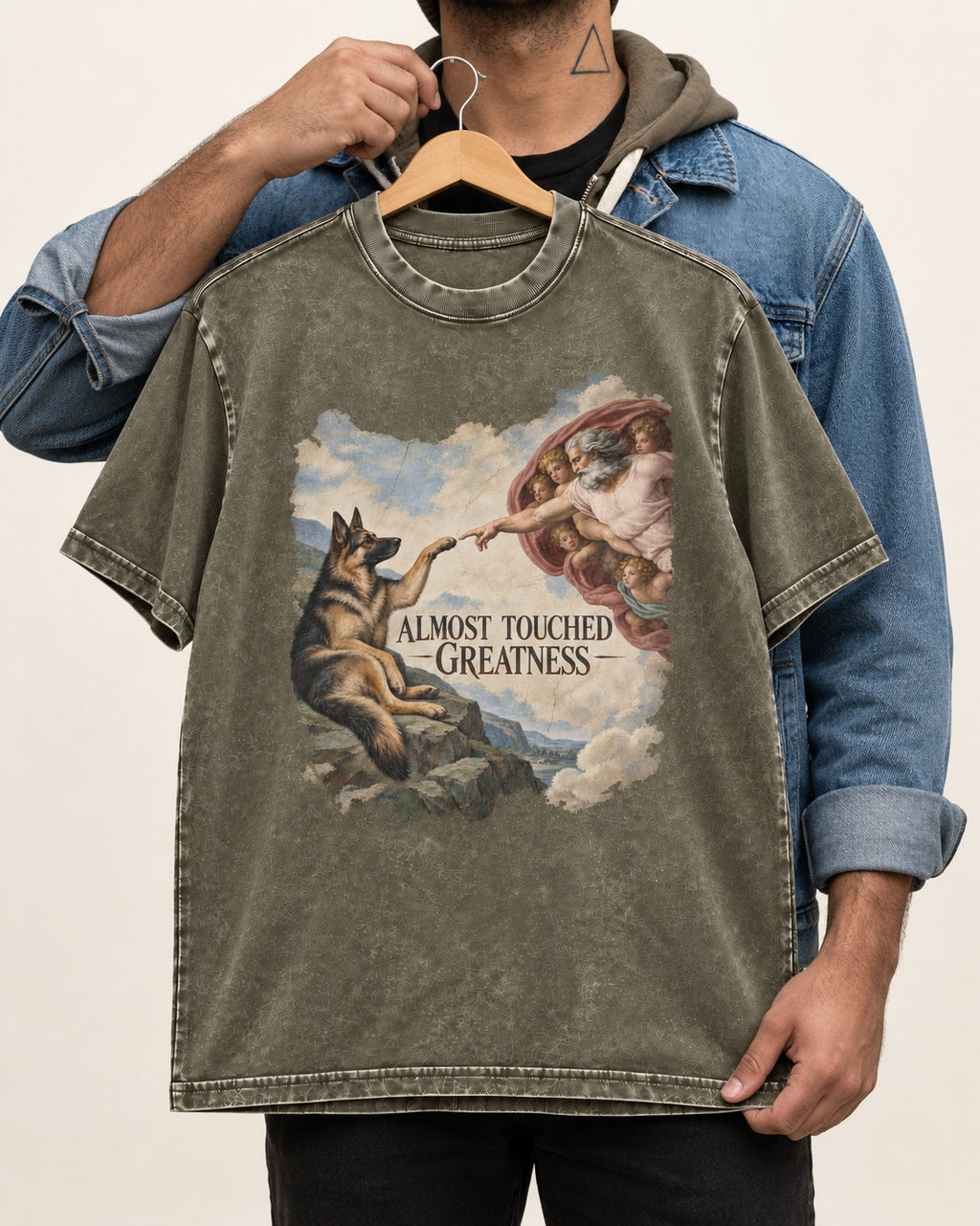 German Shepherd Dog Almost Touched Greatness Creation Parody Washed Tee in Army Green, held up on a hanger
