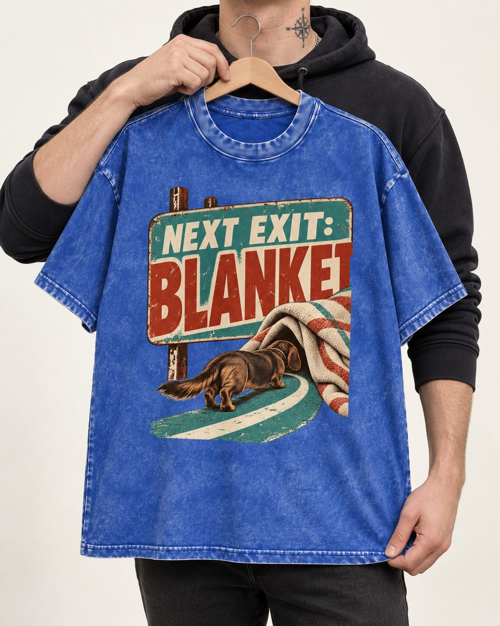 Dachshund Next Exit Blanket Road Sign Graphic Washed Tee in Royal Blue, held up on a hanger