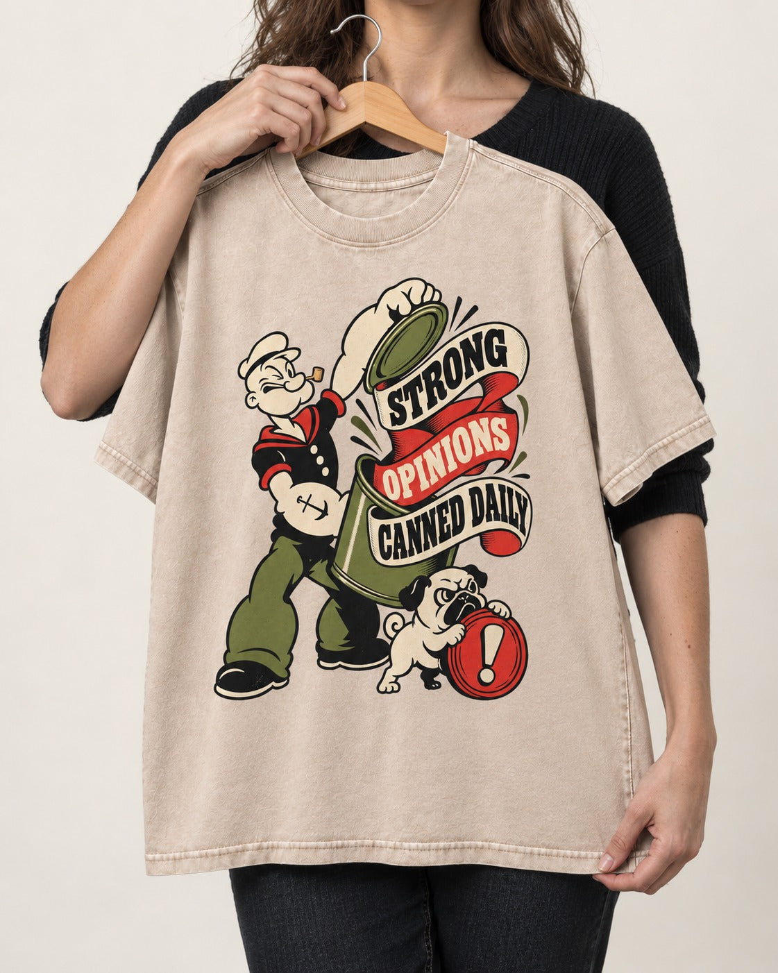 Pug Strong Opinions Washed Tee in Apricot, held up on a hanger