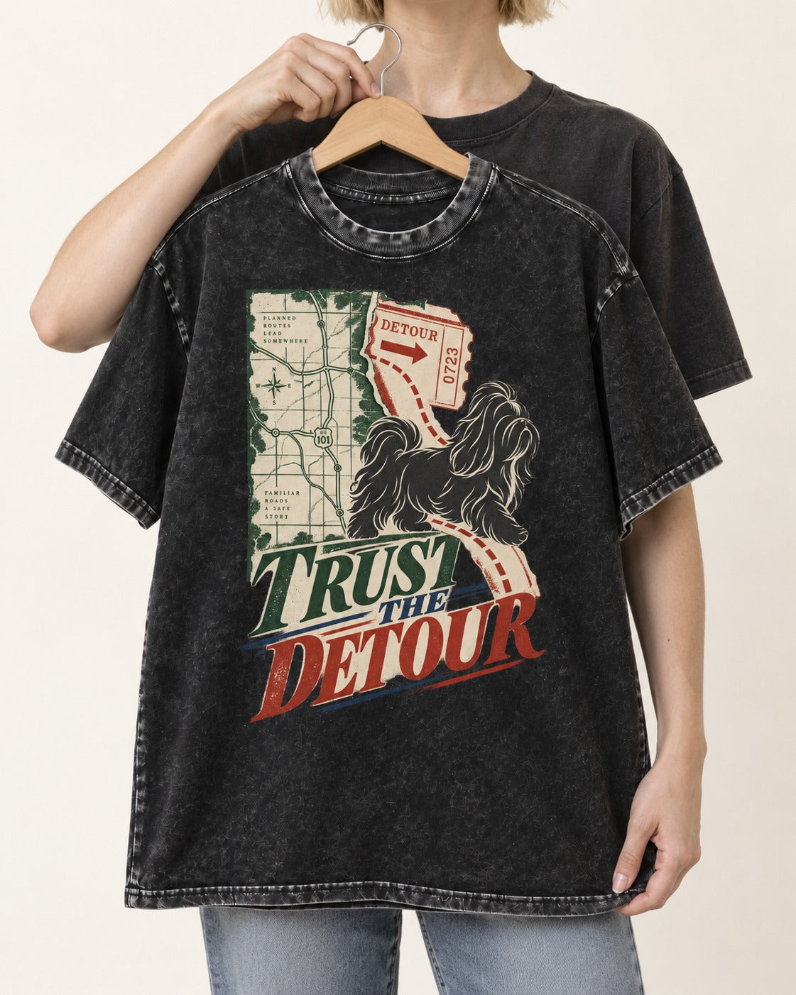 Shih Tzu Trust the Detour Road Map Graphic Washed Tee in Black, held up on a hanger