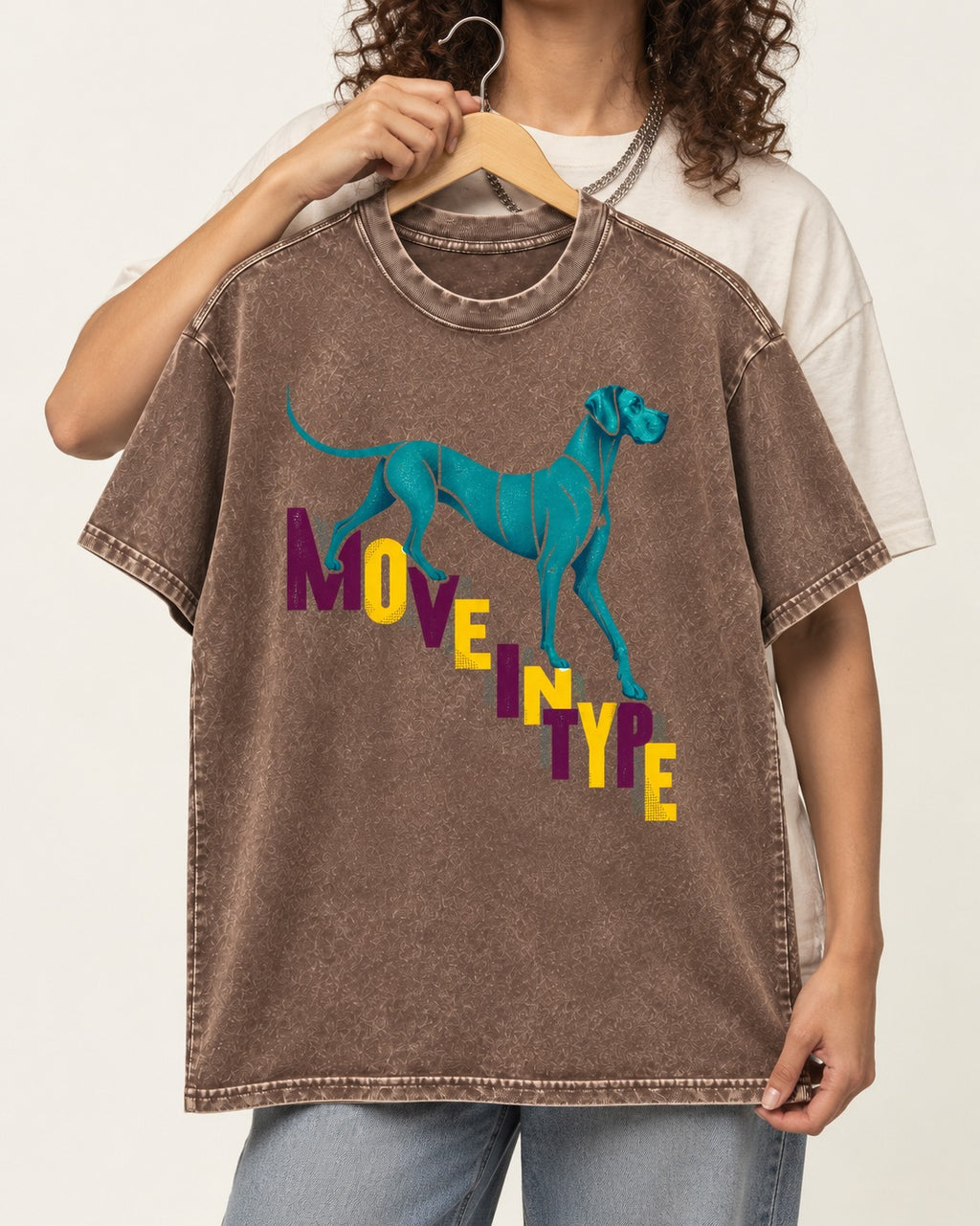 Great Dane Move in Type Washed Tee in Coffee, held up on a hanger