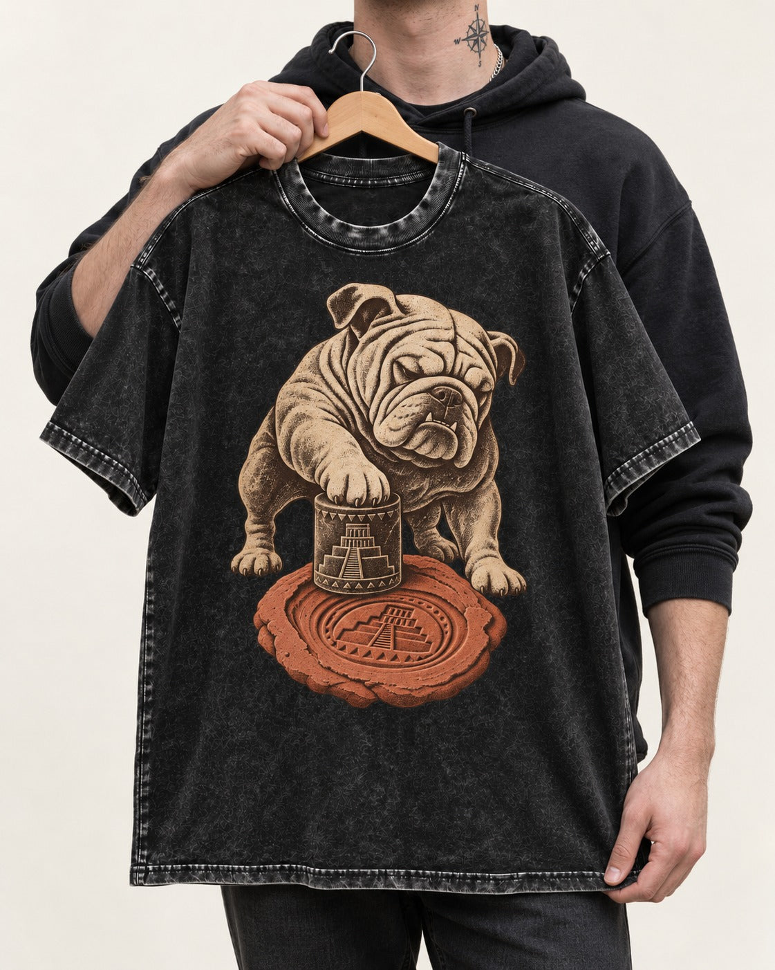 English Bulldog Ancient Cylinder Seal Graphic Washed Tee in Black, held up on a hanger