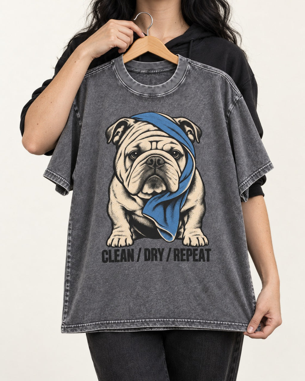 Clean Dry Repeat English Bulldog Washed Tee in Gray, held up on a hanger
