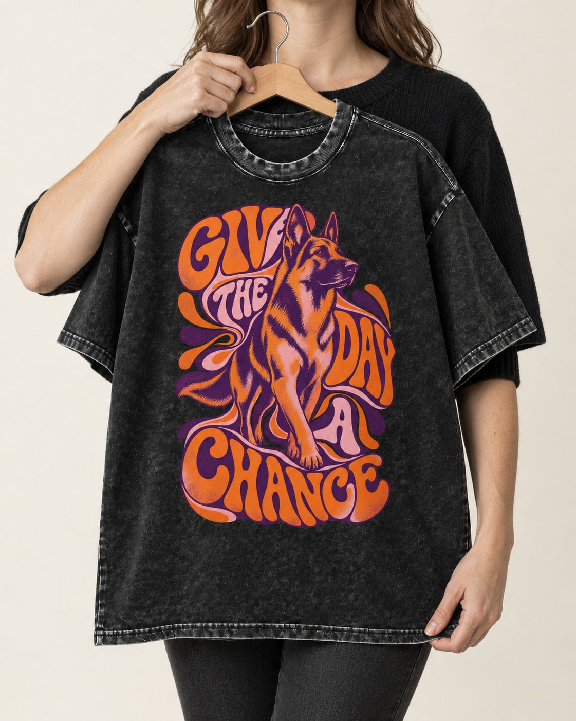 Give The Day A Chance Psychedelic German Shepherd Dog Graphic Washed Tee in Black, held up on a hanger