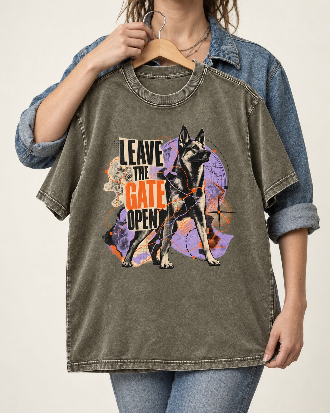Leave The Gate Open Transit Collage German Shepherd Dog Graphic Washed Tee in Army Green, held up on a hanger