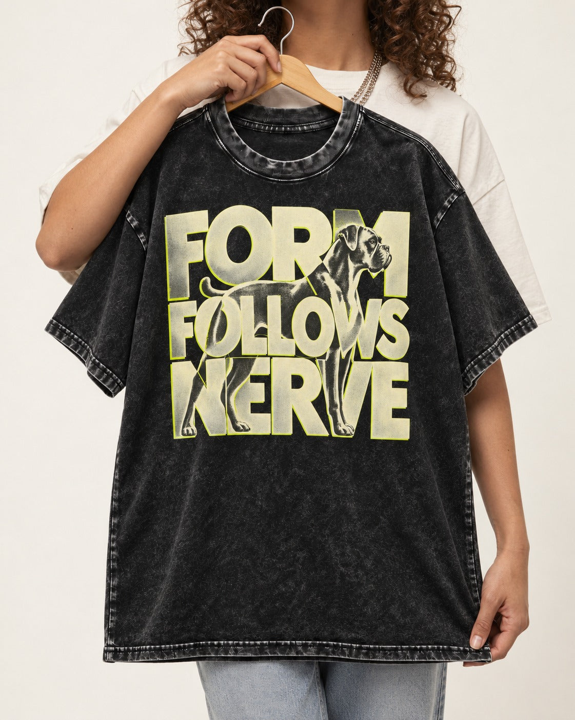 Form Follows Nerve Boxer Typography Washed Tee in Black, held up on a hanger