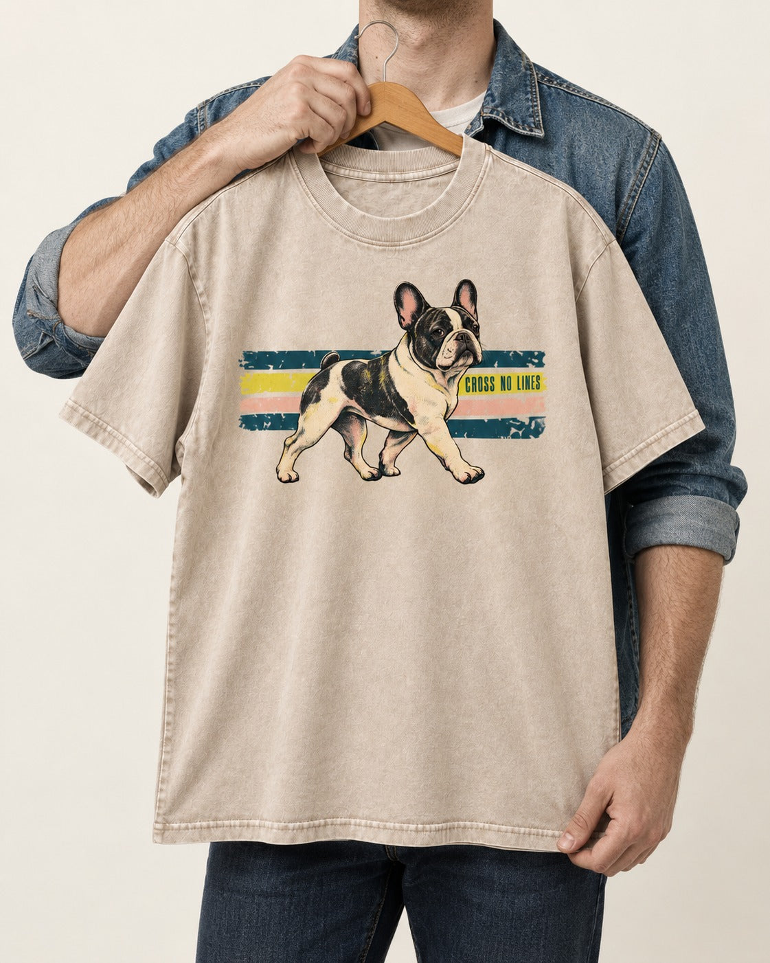 Frenchie Cross No Lines Washed Tee in Apricot, held up on a hanger