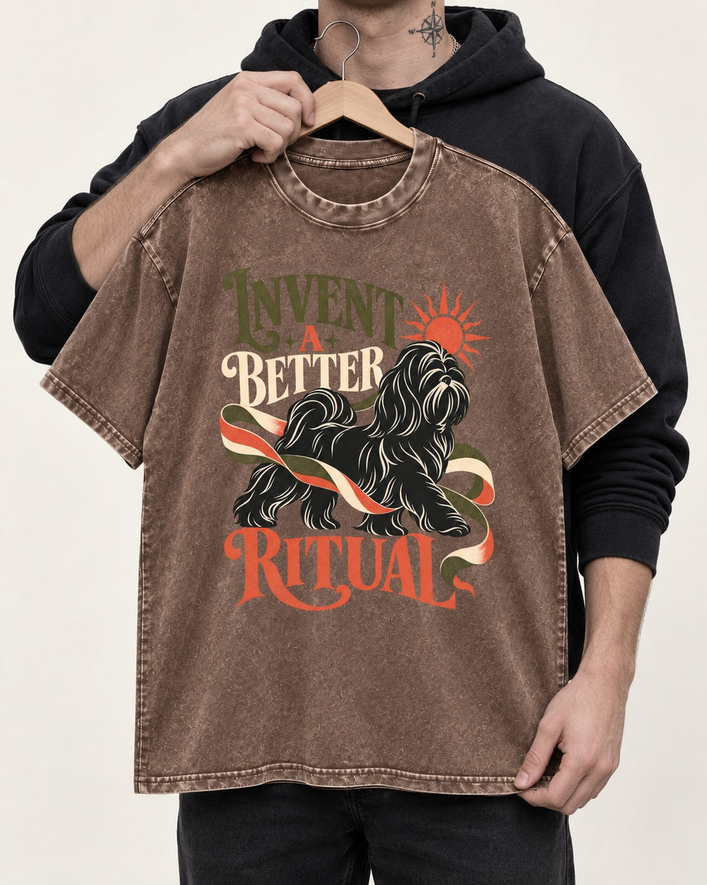 Shih Tzu Invent A Better Ritual Sunrise Ribbon Graphic Washed Tee in Coffee, held up on a hanger