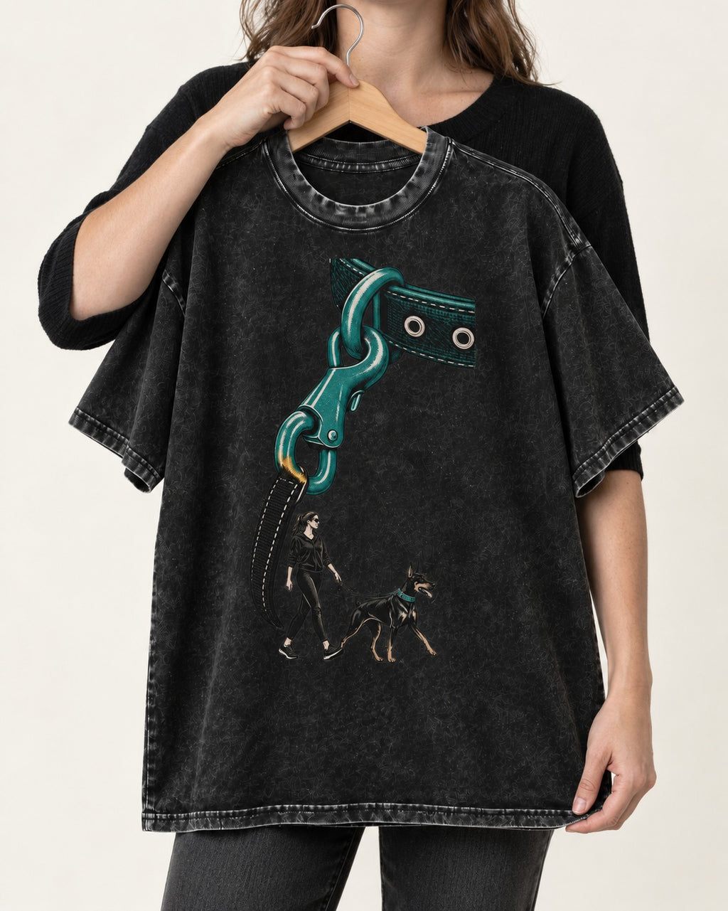 Doberman Oversized Leash Hardware Walk Graphic Washed Tee in Black, held up on a hanger