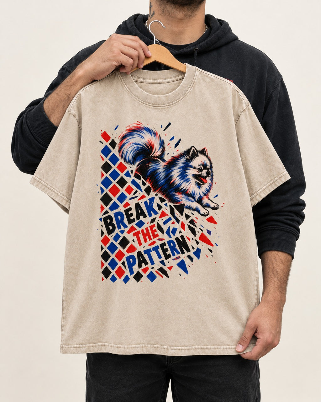 Pomeranian Break the Pattern Washed Tee in Apricot, held up on a hanger