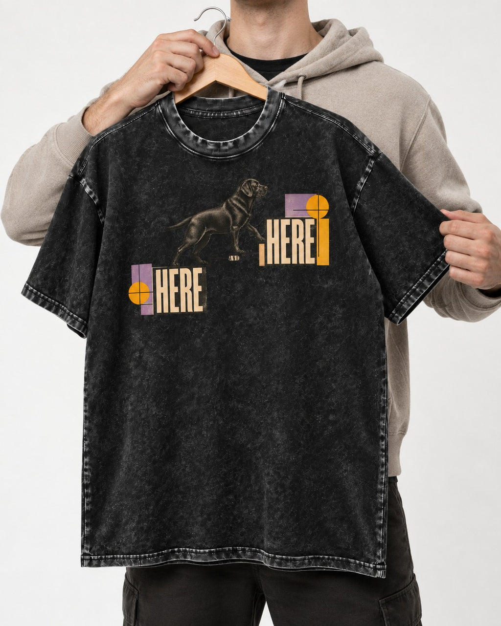 Here and Here Stepping Labrador Retriever Graphic Washed Tee in Black, held up on a hanger