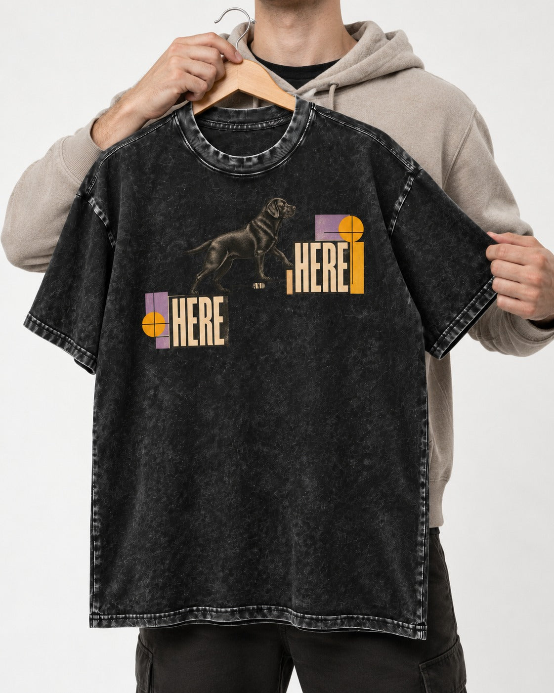 Here and Here Stepping Labrador Retriever Graphic Washed Tee in Black, held up on a hanger