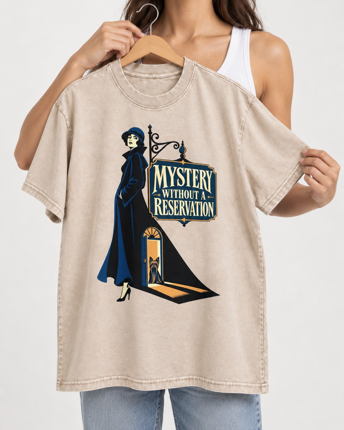 Mystery Without a Reservation Yorkshire Terrier Washed Tee in Apricot, held up on a hanger