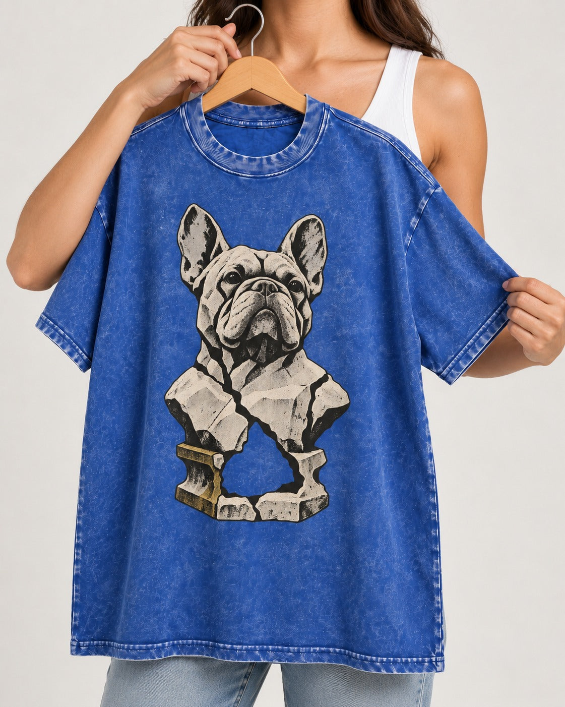 Frenchie Fractured Stone Bust Graphic Washed Tee in Royal Blue, held up on a hanger