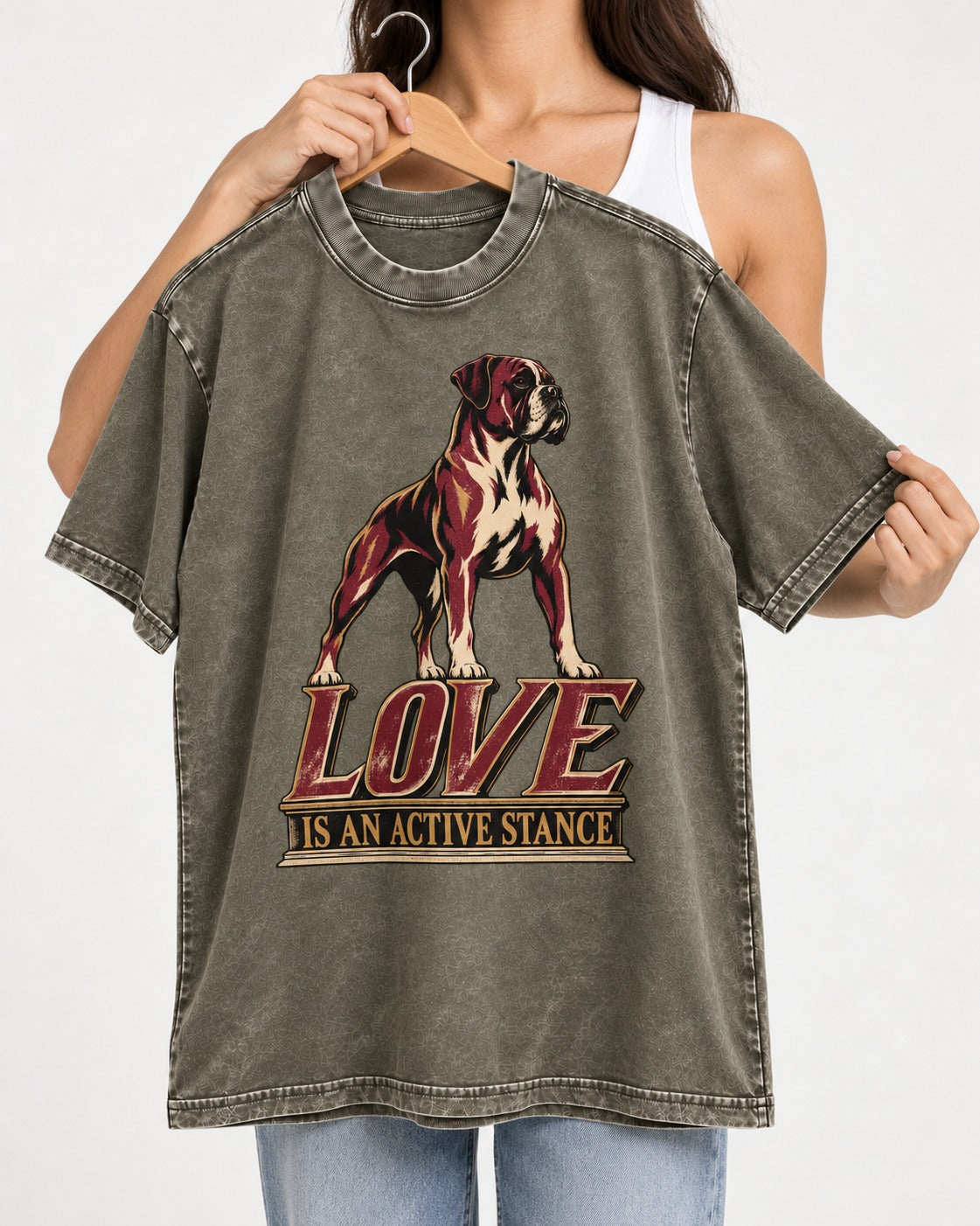 Love Is an Active Stance Boxer Pedestal Graphic Washed Tee in Army Green, held up on a hanger