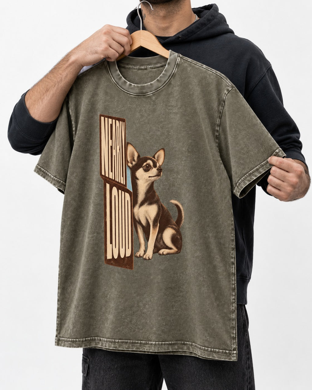 Chihuahua Never Loud Washed Tee in Army Green, held up on a hanger