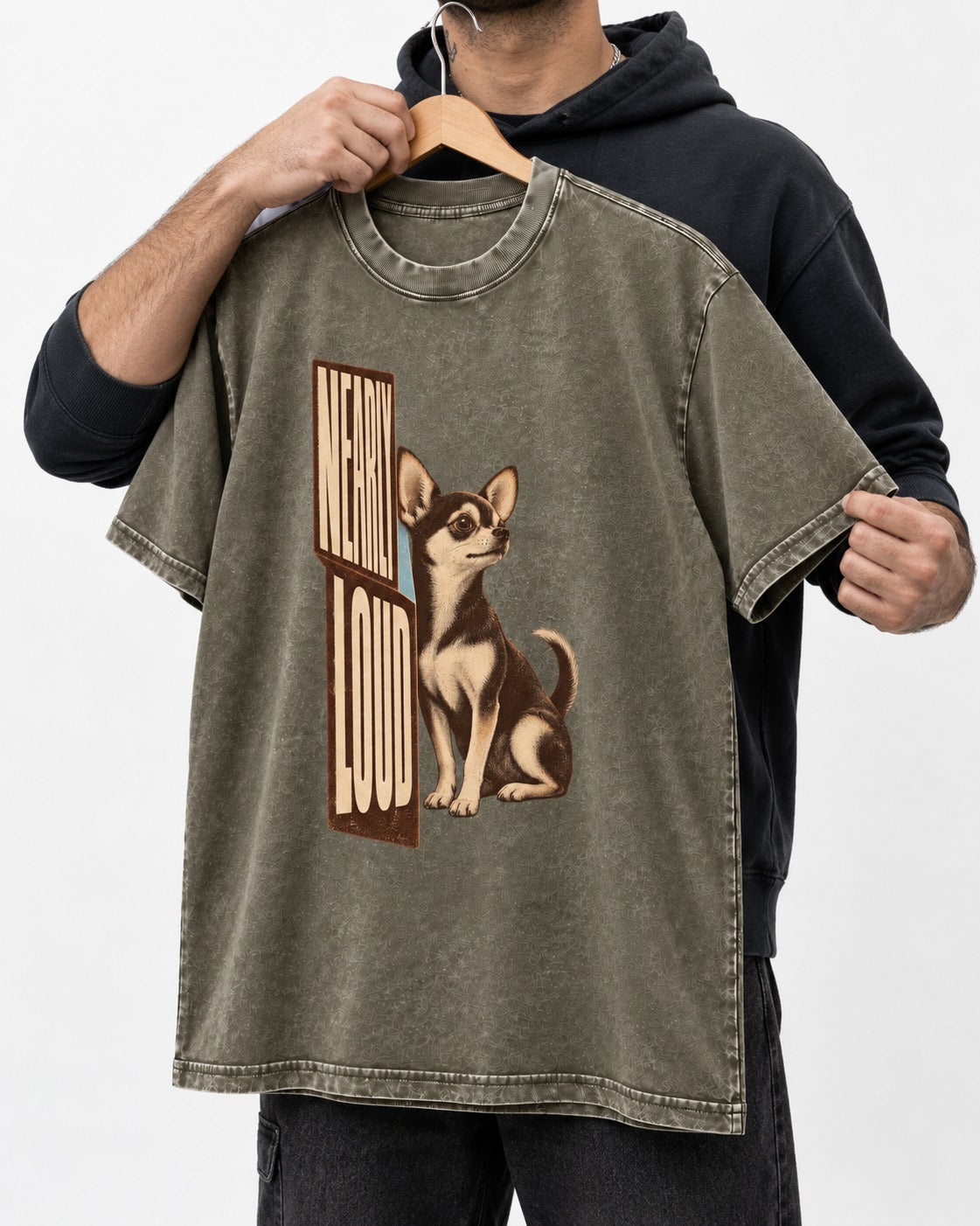 Chihuahua Never Loud Washed Tee in Army Green, held up on a hanger