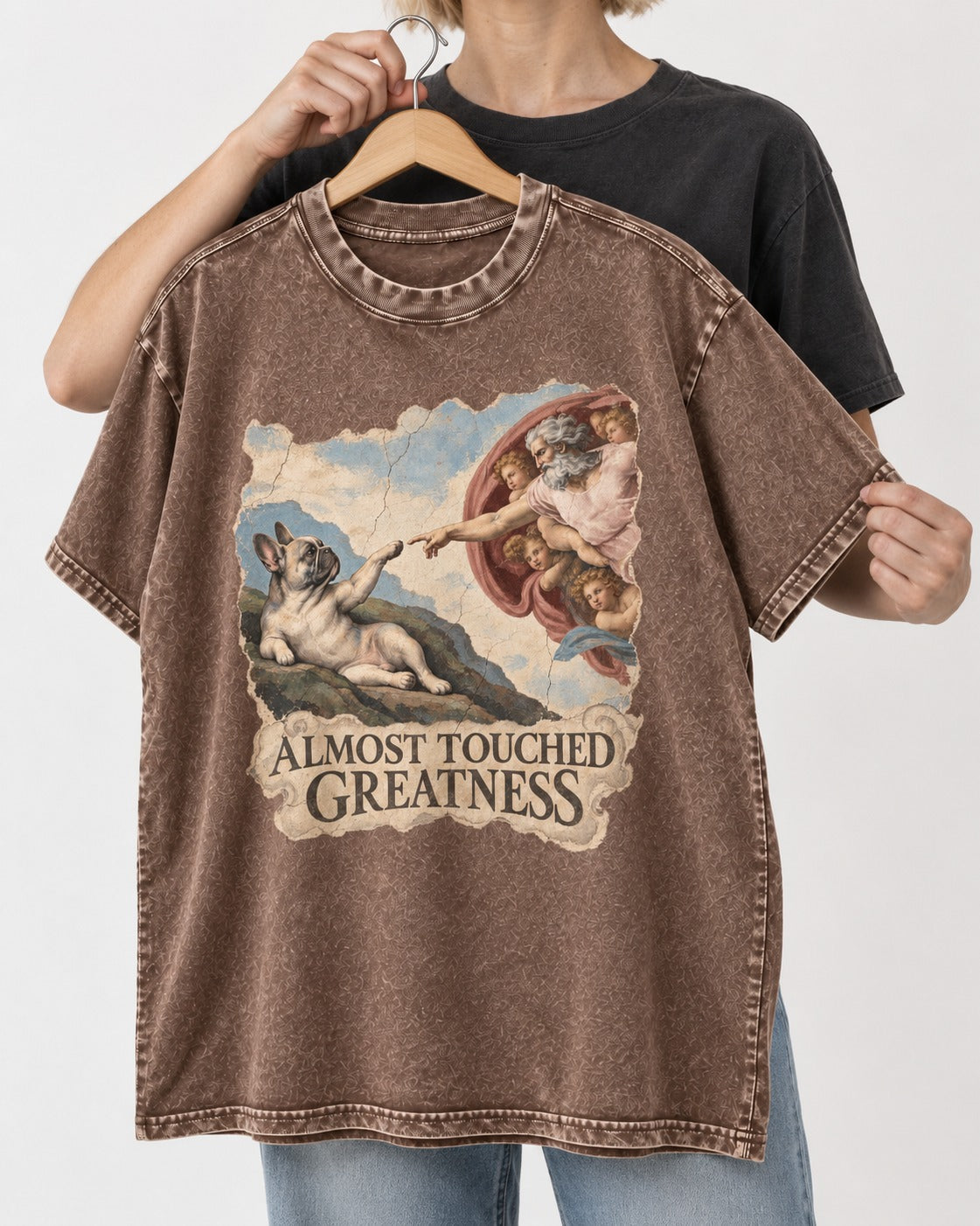 Frenchie Almost Touched Greatness Washed Tee in Coffee, held up on a hanger