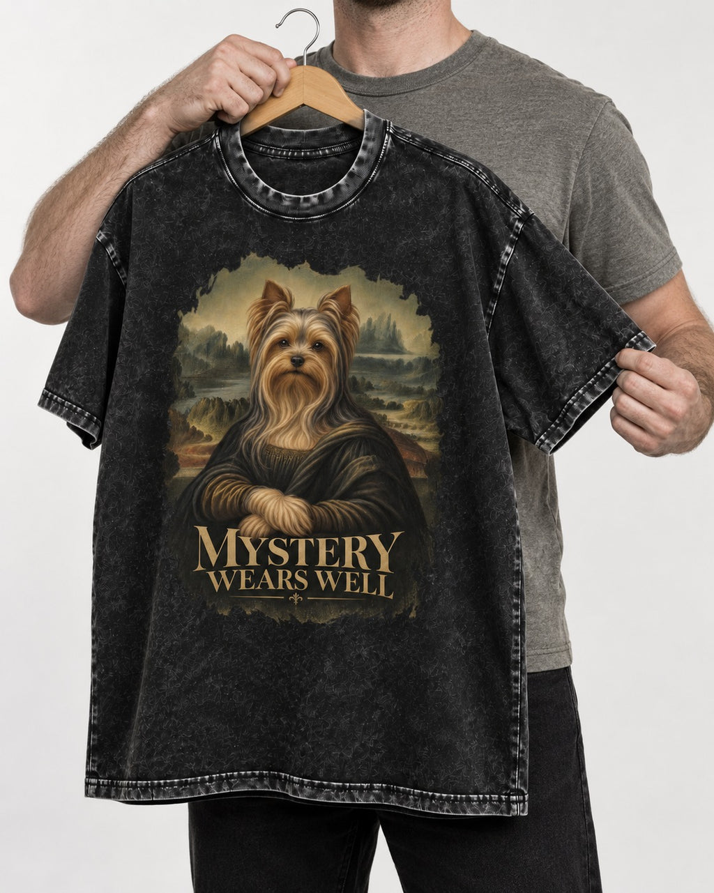 Yorkshire Terrier Mystery Wears Well Mona Lisa Portrait Graphic Washed Tee in Black, held up on a hanger