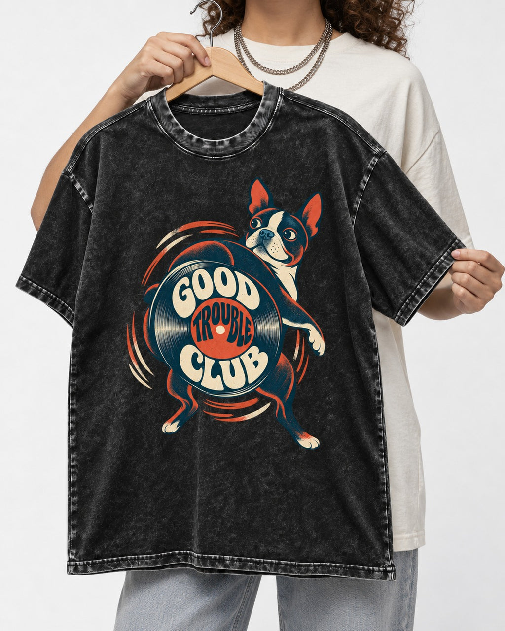 Good Trouble Club Boston Terrier Washed Tee in Black, held up on a hanger