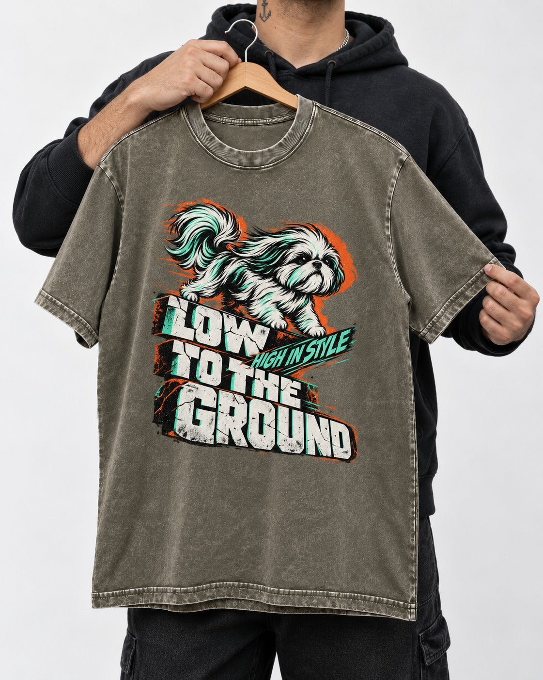 Shih Tzu Low to the Ground High in Style Streetwear Graphic Washed Tee in Army Green, held up on a hanger