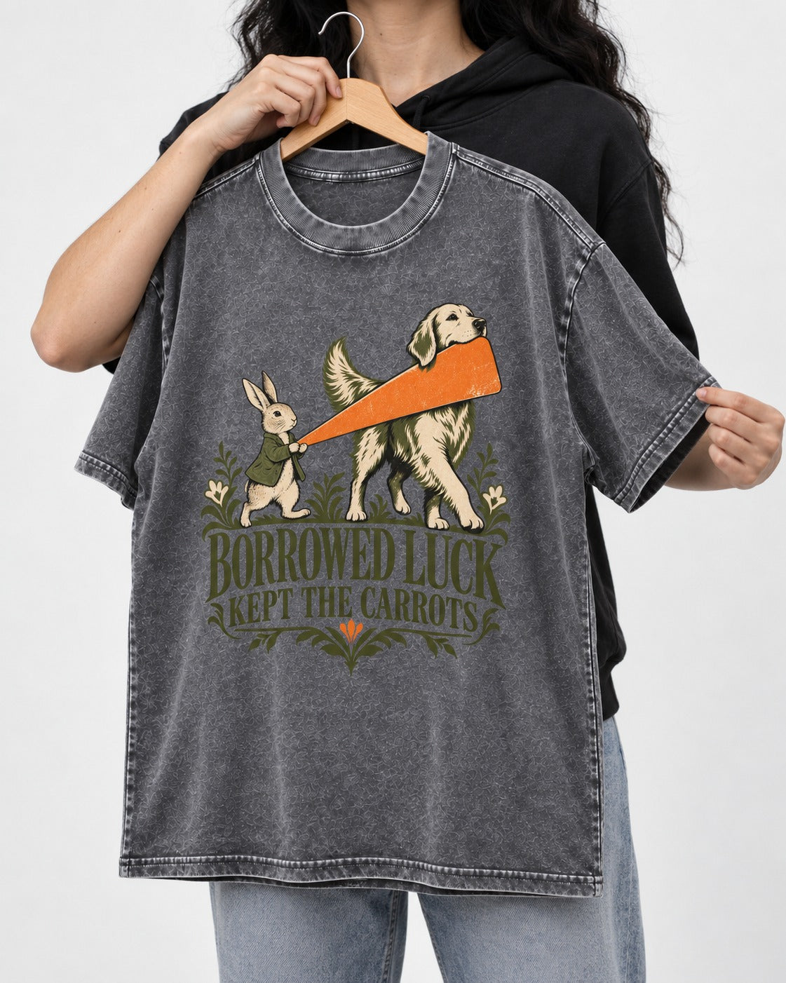 Borrowed Luck Golden Retriever Washed Tee in Gray, held up on a hanger