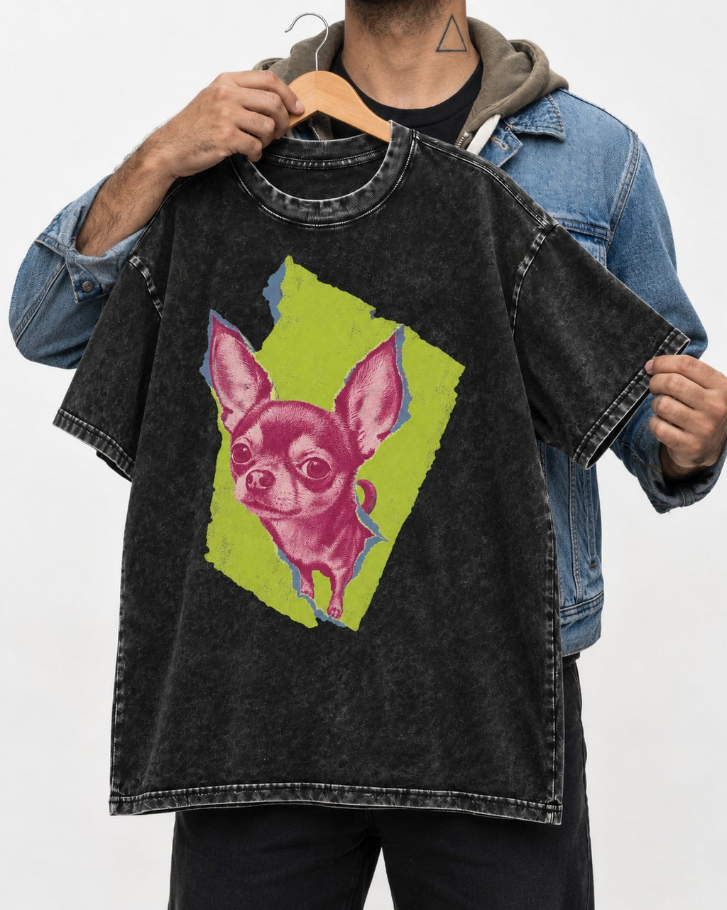 Torn-Paper Chihuahua Portrait Washed Tee in Black, held up on a hanger