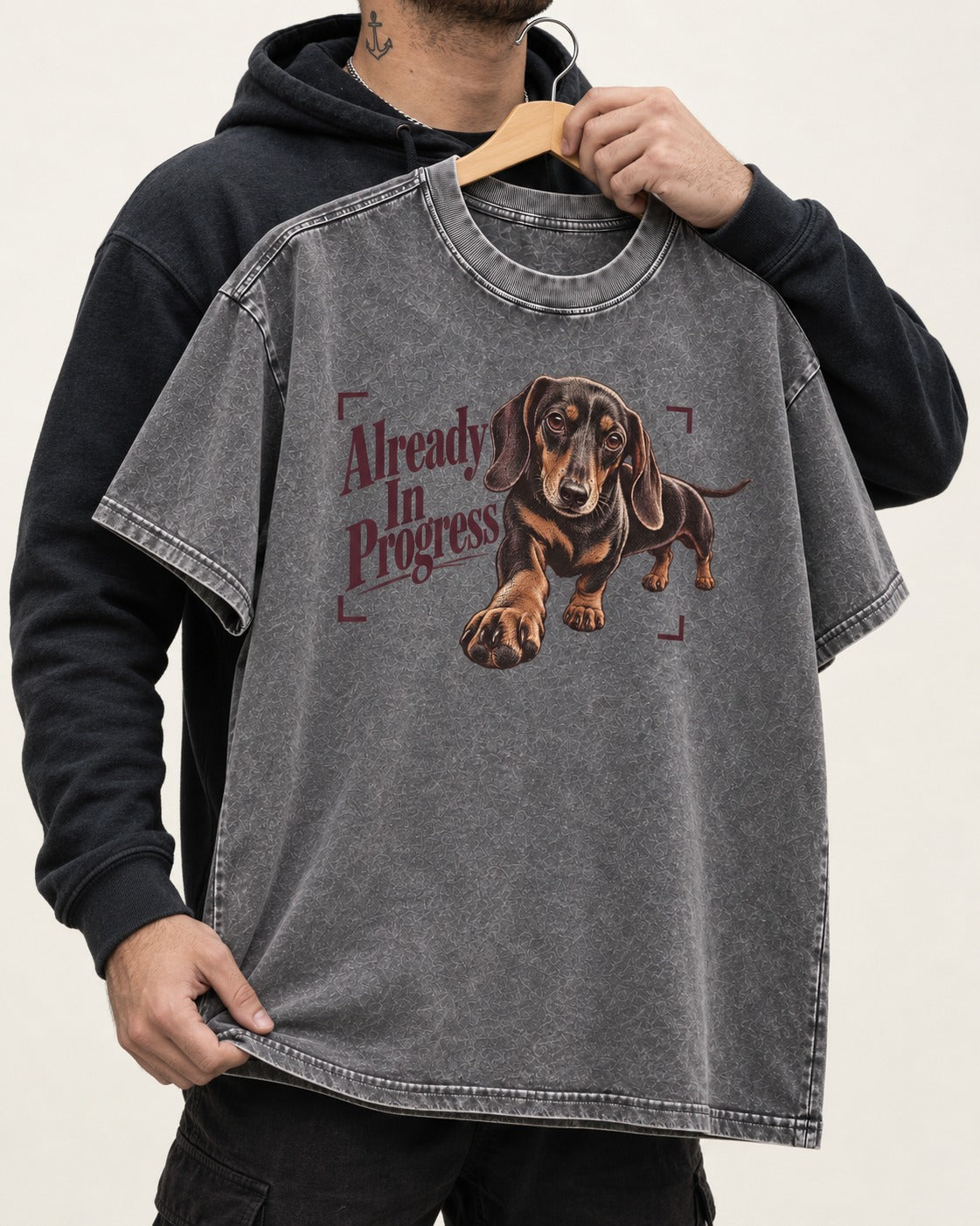 Dachshund Already in Progress Washed Tee in Gray, held up on a hanger