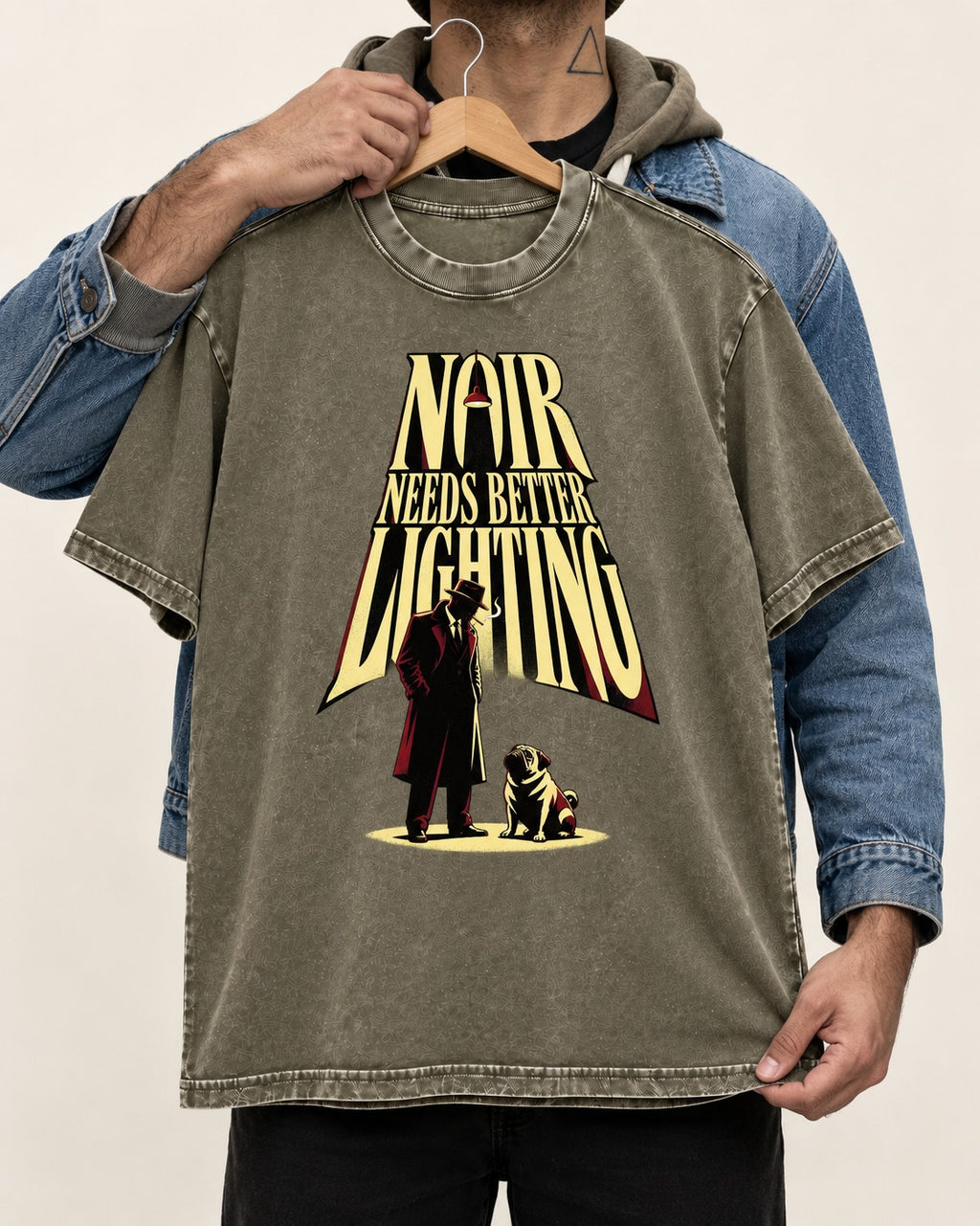 Pug Noir Needs Better Lighting Detective Graphic Washed Tee in Army Green, held up on a hanger