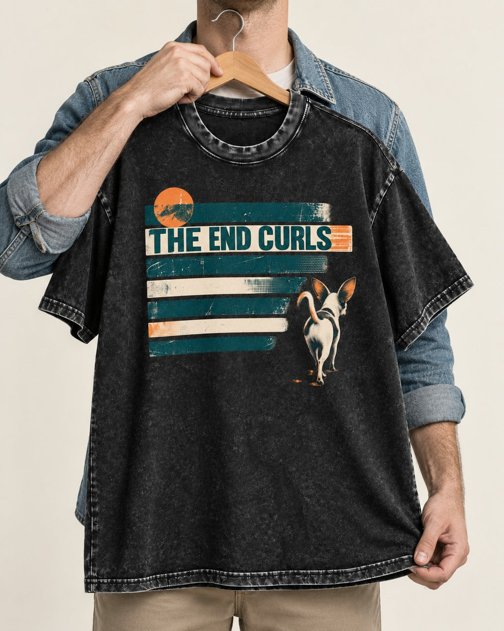 Chihuahua The End Curls Retro Stripe Graphic Washed Tee in Black, held up on a hanger