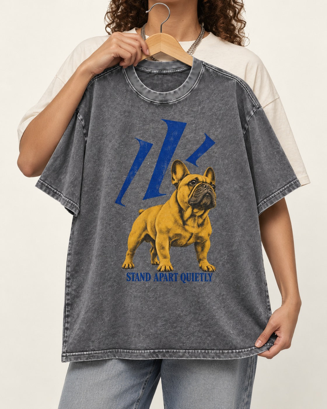 Frenchie Stand Apart Quietly Washed Tee in Gray, held up on a hanger