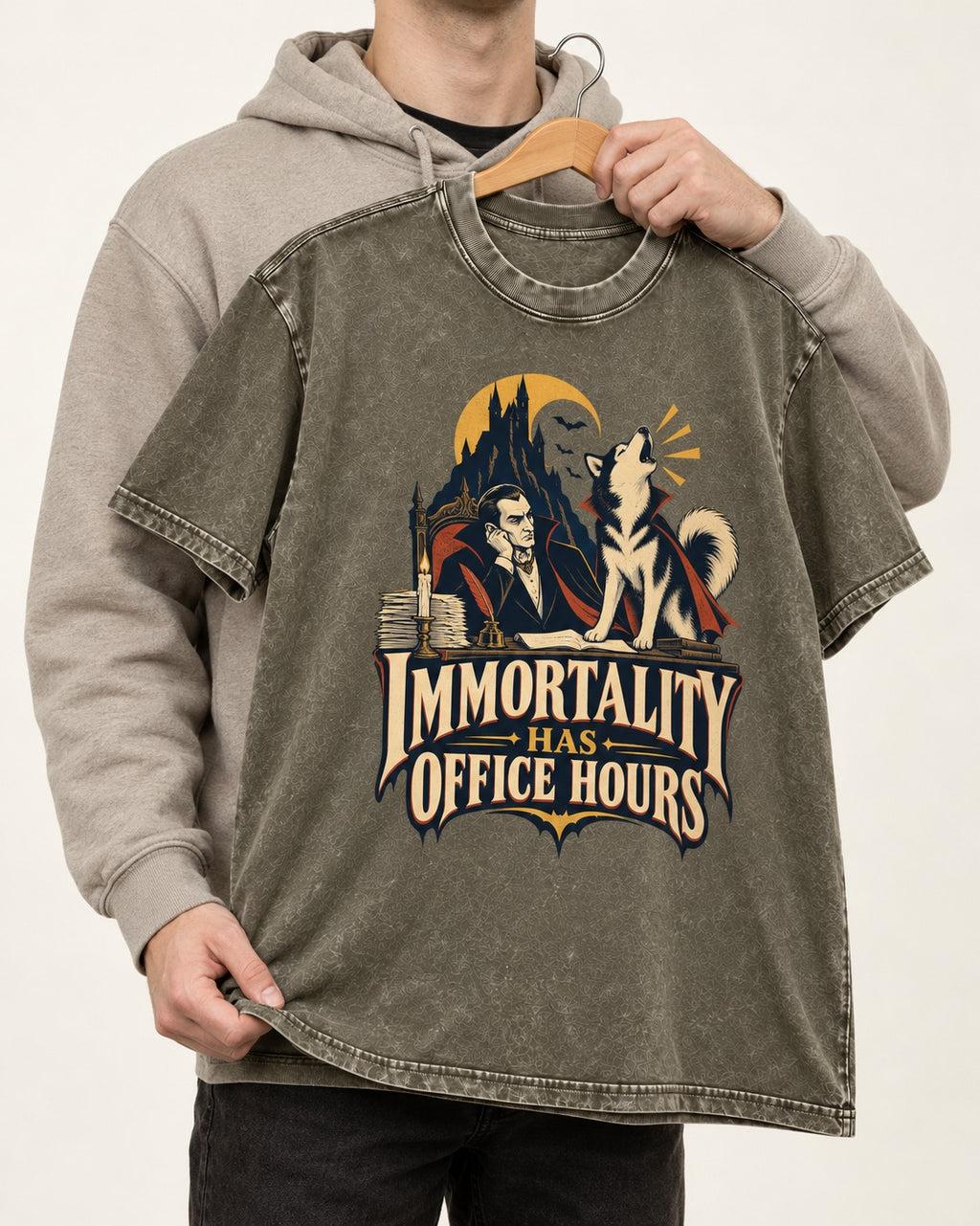 Husky Immortality Has Office Hours Vampire Office Graphic Washed Tee in Army Green, held up on a hanger