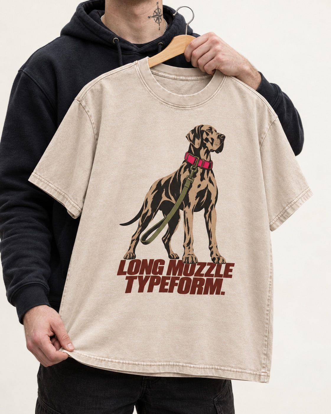 Long Muzzle Typeform Great Dane Washed Tee in Apricot, held up on a hanger