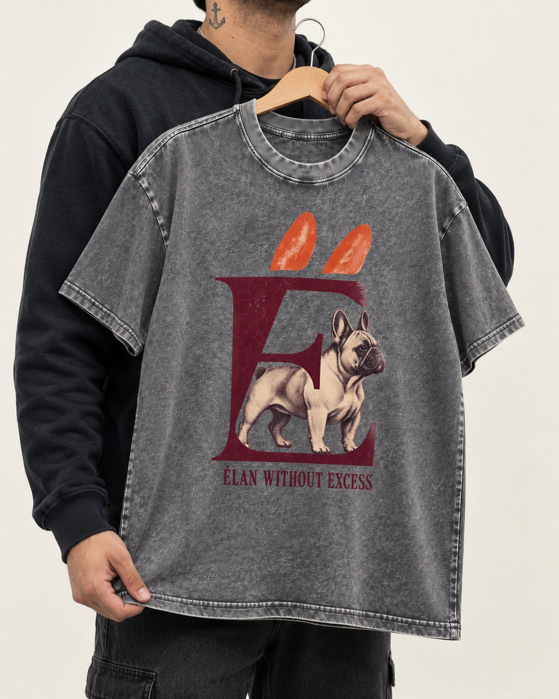 Frenchie Without Excess Washed Tee in Gray, held up on a hanger